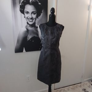 Sleeveless knee length dress with back split